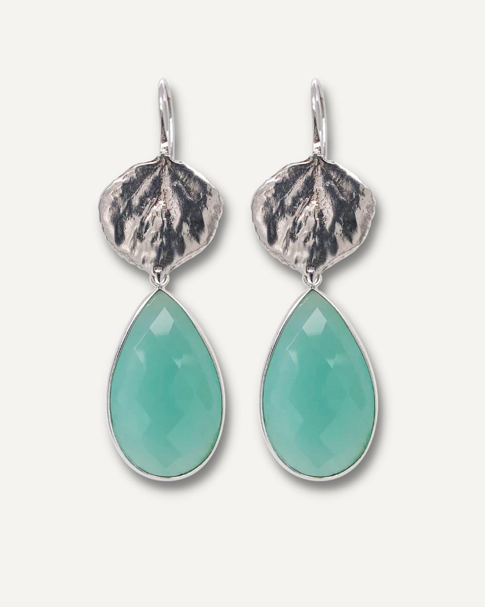 Aqua chalcedony gemstone drop earrings on cream background.
