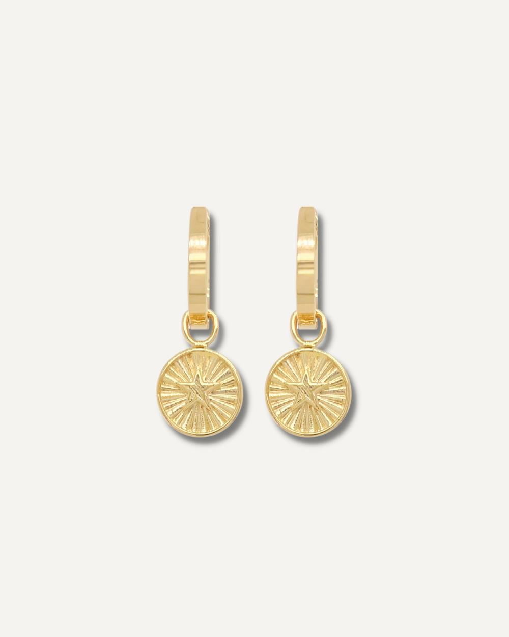 Charm earrings with star motif.