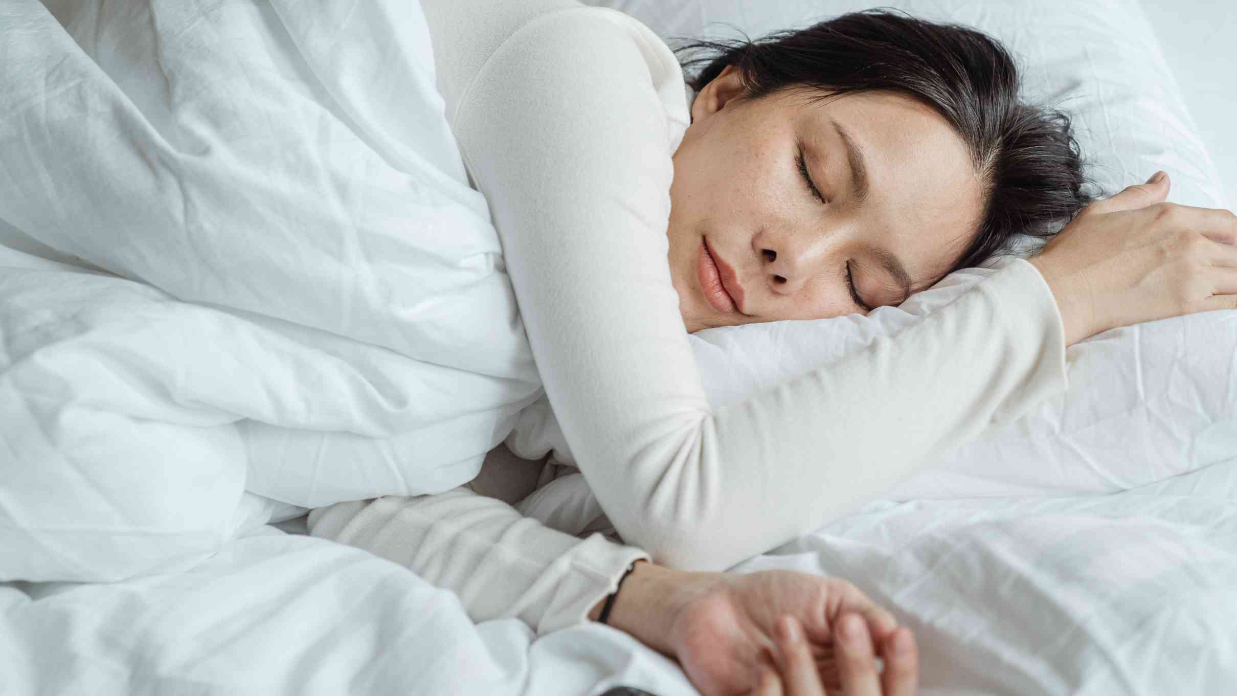 woman sleeping with no earrings.